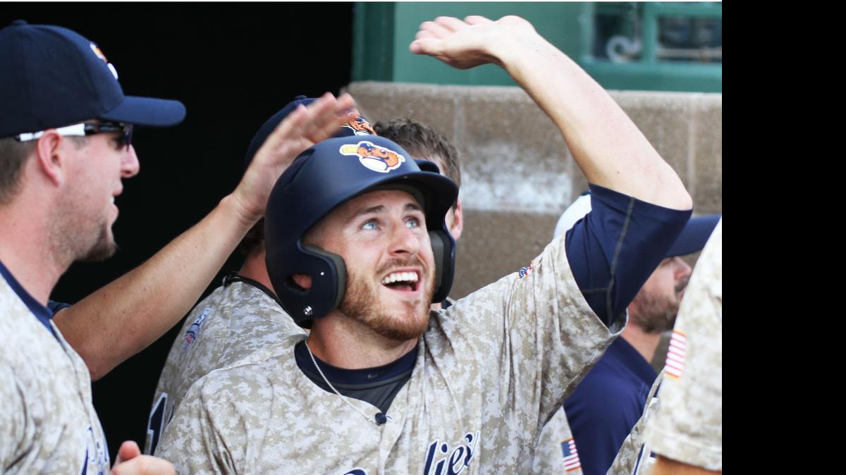 
The Grizzlies' Madison Beaird is congratulated in the dugout after they took a 2-0 lead against River City on Sunday night at GCS Ballpark. 
