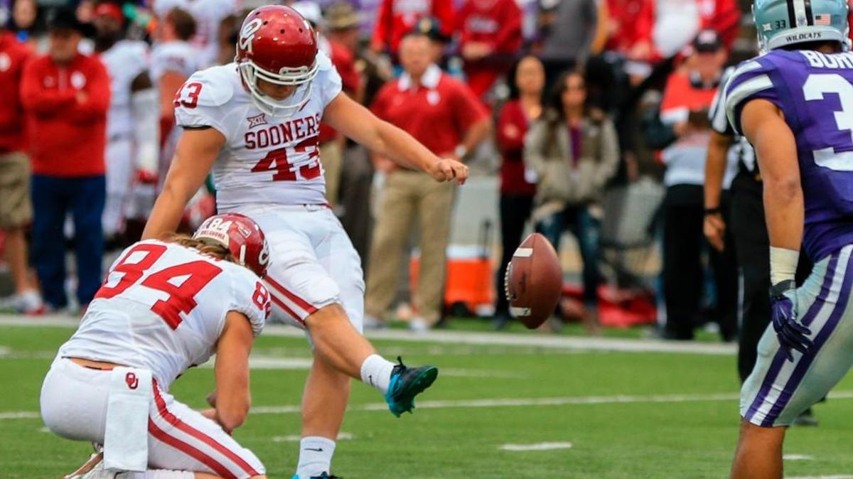Former Belleville West kicker/punter Austin Seibert (43) kicks an extra point for Oklahoma last month against Kansas State. Seibert is one of 10 national semifinalists for the Ray Guy Award.