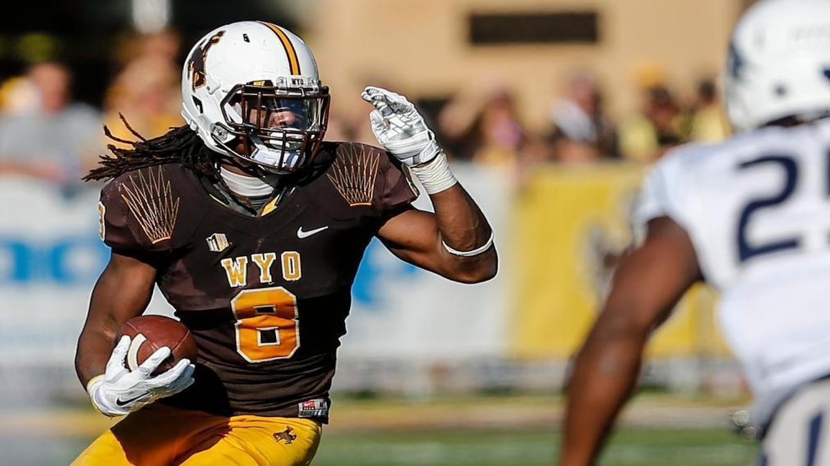 Wyoming sophomore and Belleville West graduate Brian Hill ran for a school-record 1,631 yards this season. He is shown here playing against Nevada.