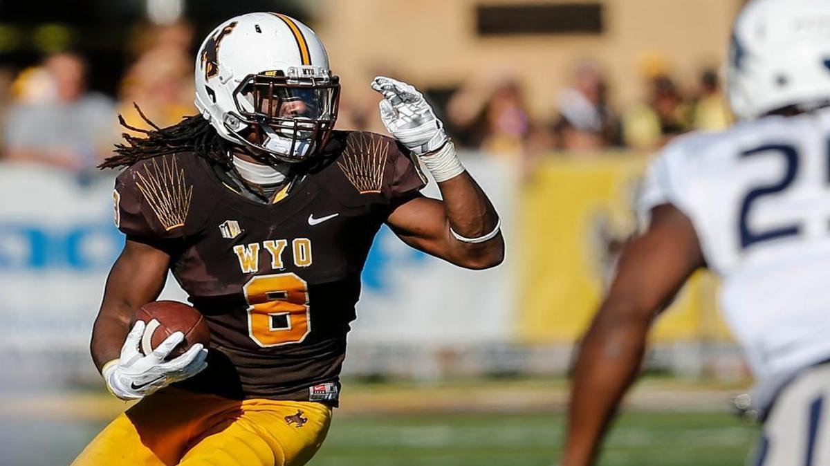 Wyoming sophomore and Belleville West graduate Brian Hill ran for a school-record 1,631 yards this season. He is shown here playing against Nevada.