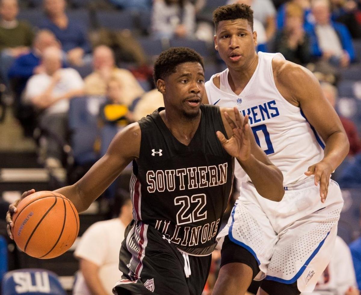 Southern Illinois University Carbondale’s Armon Fletcher, left, fights past Saint Louis University’s Jordan Goodwin on Wednesday, Dec. 6, 2017, during the Billikens and Salukis’ matchup at Chaifetz Arena in St. Louis, Missouri.