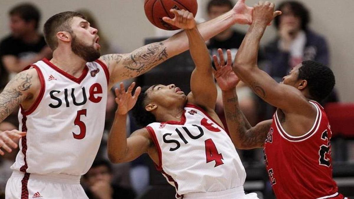 C.J. Carr (No. 4) and teammate Grant Fiorentinos battle for a rebound in a game earlier this season against Arkansas State. Carr was named the Ohio Valley Conference Co-Player of the Week.