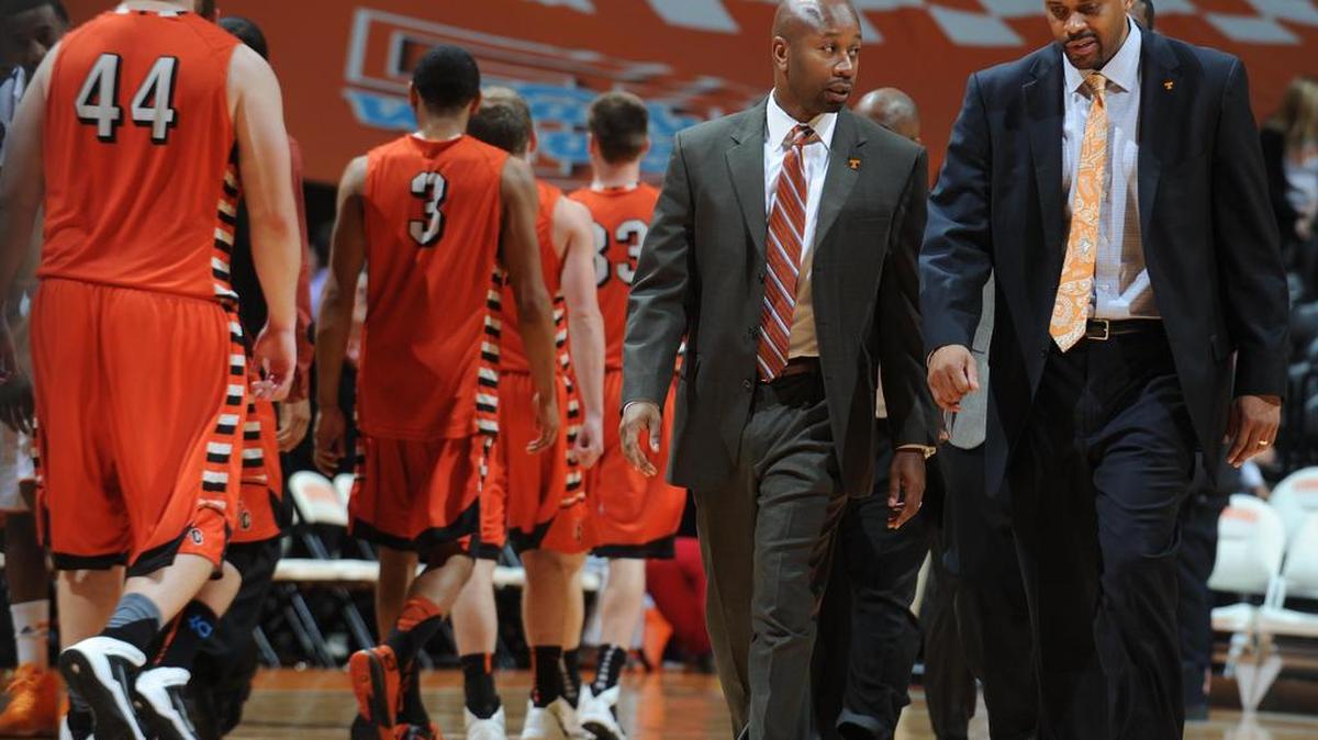 Cuonzo Martin (right) left the court with Marco Harris in 2013 after a Tennessee victory.
