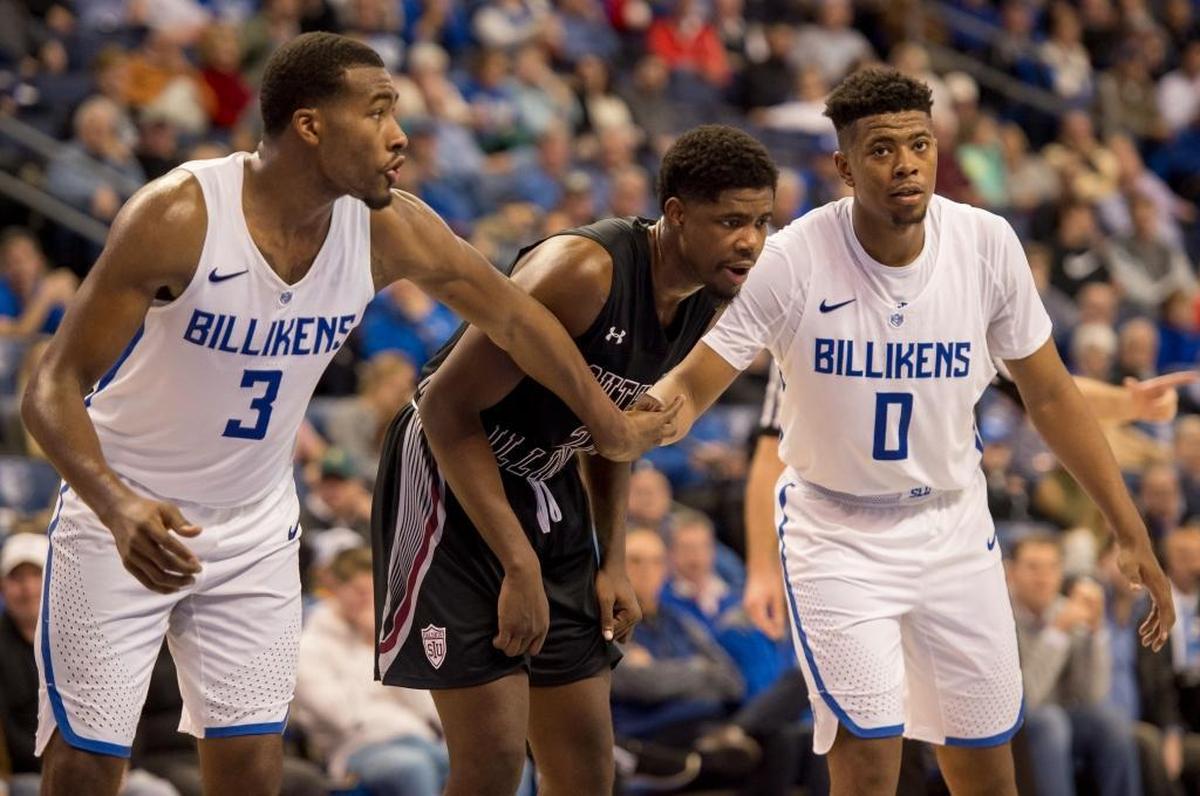 Saint Louis University’s Javon Bess, left, and Jordan Goodwin hold back Southern Illinois University Carbondale’s Armon Fletcher on Wednesday, Dec. 6, 2017, during the Billikens and Salukis’ matchup at Chaifetz Arena in St. Louis, Missouri.