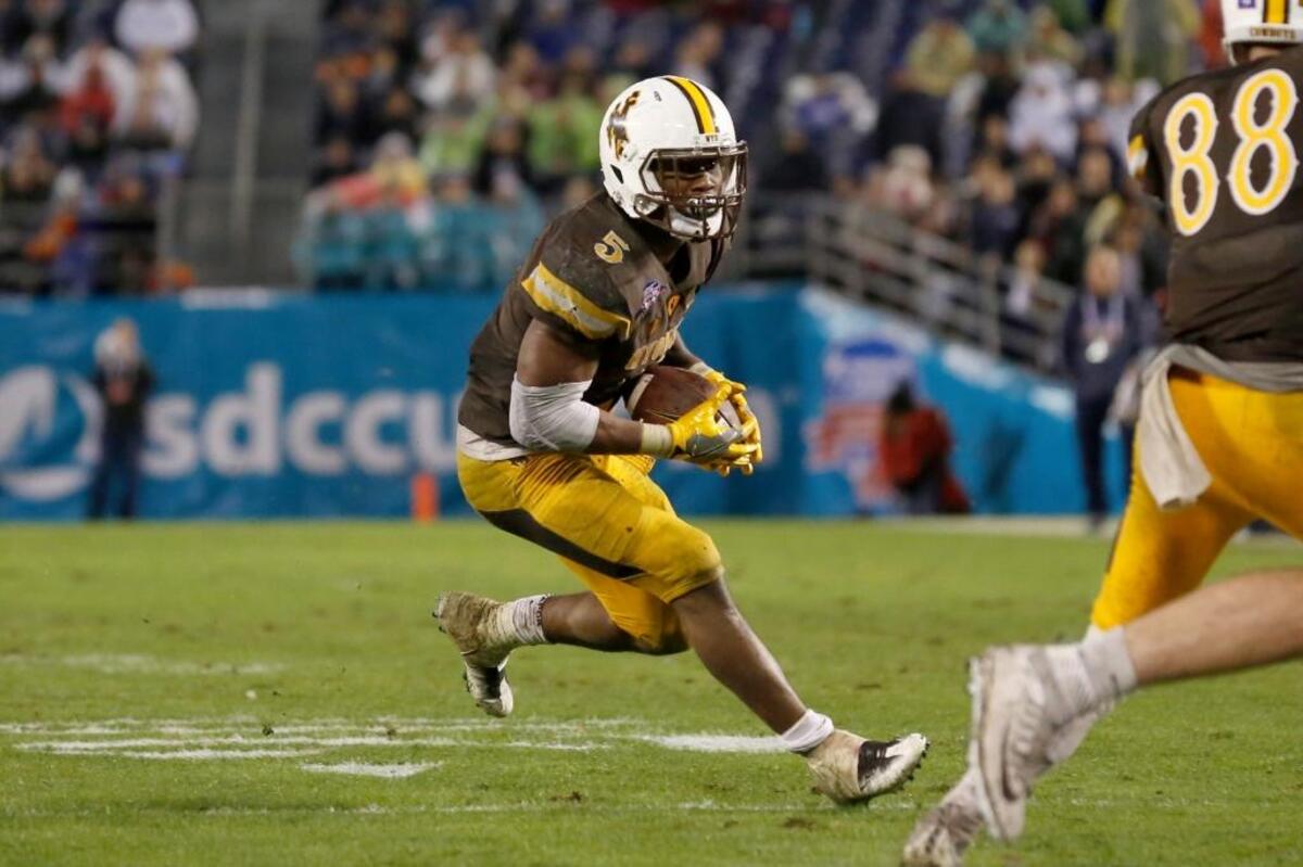 Wyoming running back Brian Hill runs the football during the second half of the Poinsettia Bowl in December.
