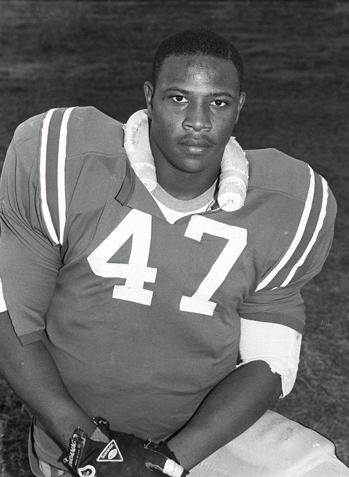 In this 1989 file photo, Dana Howard, an All-American linebacker with the East St. Louis High School football team is shown. Howard helped lead the Flyers to a 55-8 win in the Class 6A state championship game against (Harvey) Thornton in Normal on Nov. 25, 1989. The win was the fifth of their seven state titles. Howard went on to play at the University of Illinois and was later drafted into the NFL. He’ll be inducted to the College Football Hall of Fame in 2018.