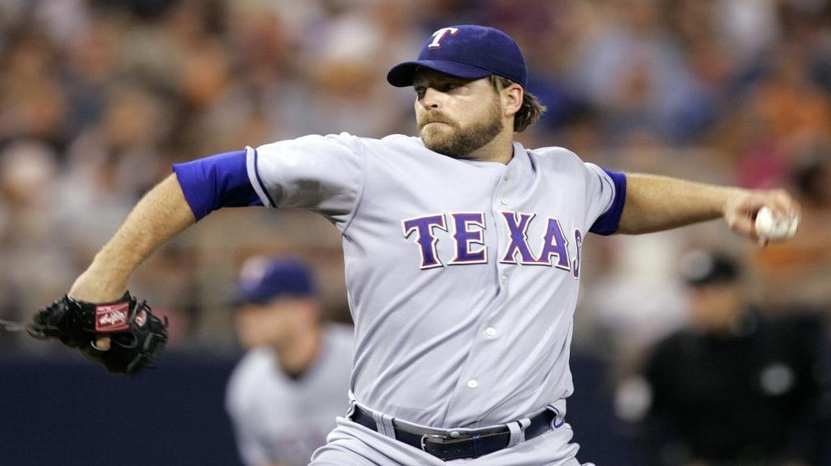 Former major league pitcher John Rheinecker, who graduated from Gibault Catholic High School in Waterloo, died Tuesday in St. Louis.