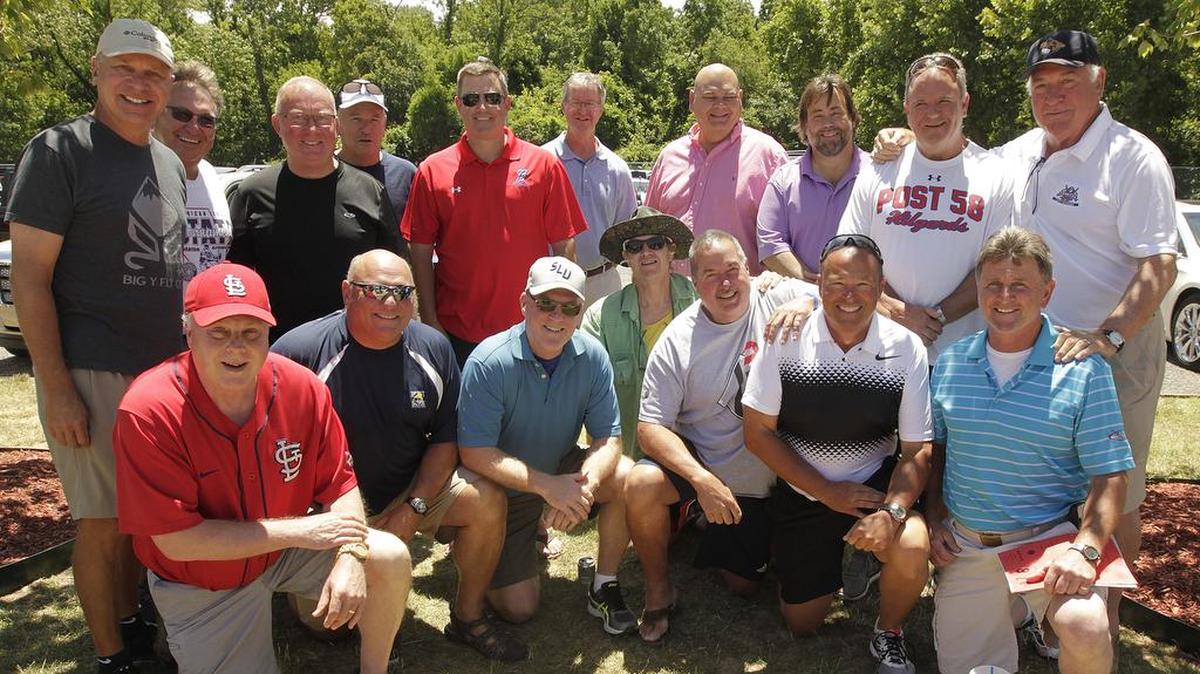 In this BND file photo from June 24, 2017, former Belleville Hilgards players pose together for a group photo between the junior- and senior-team games. There was an induction ceremony for several players into the Hilgards Hall of Fame, and Cal Isselhardt — the last surviving member of the first 1938 Hilgards team — was in Belleville to be recognized and throw out the first pitch.