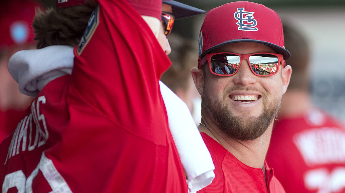 St. Louis Cardinals pitcher Bud Norris laughs with Miles Mikolas in the dugout of Roger Dean Stadium during spring training in Jupiter, Florida, on Thursday.