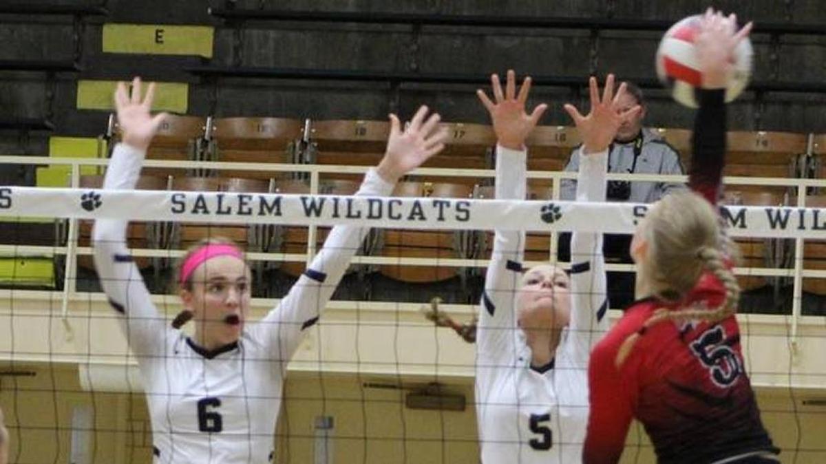 Atlhoff’s Karinna Gall and Grace Strieker go for a block against Mount Zion’s Reiley Drake during the Salem Class 3A Volleyball Super-Sectional last week. The Crusaders will be playing for the state championship Saturday.