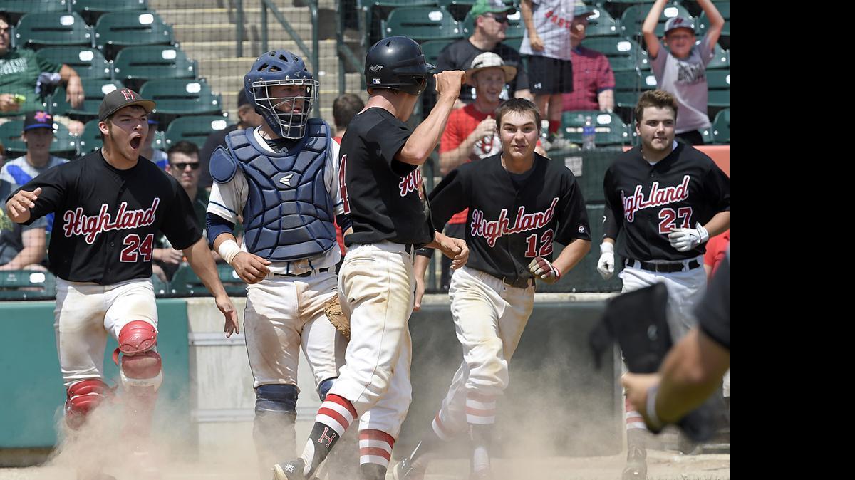 
Highland's (4) Tyler Kimmle jumps up after scoring the winning run in the bottom of the 7th inning against LaGrange Park (Nazareth Academy) and Highland won 7-6 at the IHSA 3A State Championship game held at Silver Cross Field, Joliet, IL. on Saturday,June 13, 2015. | Larry W. Kane for Belleville News-Democrat Media 
