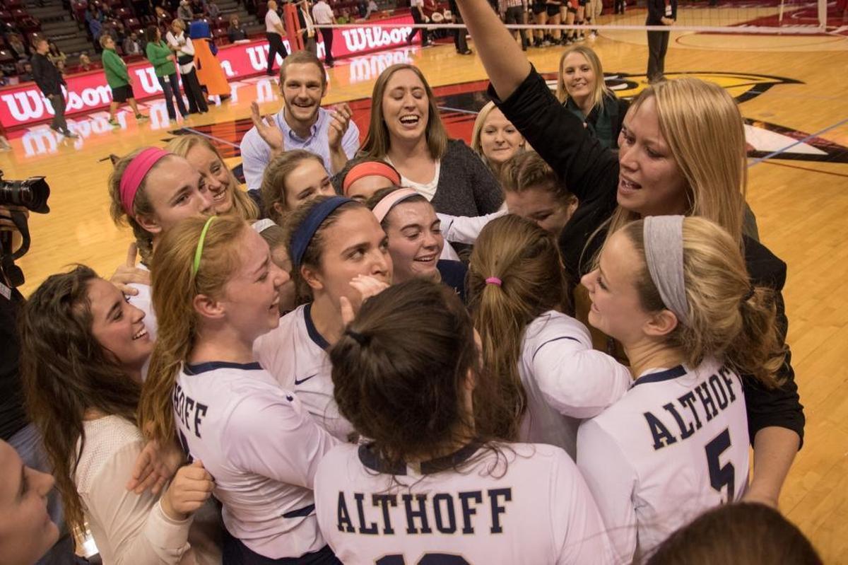 Then-Althoff head coach Sarah Thomas-Dietrich celebrates the Illinois Class 3A volleyball championship with her team in 2017. In the latest Belleville News-Democrat poll, we asked readers to vote on their favorite high school fall sport, with girls volleyball as one of the choices.