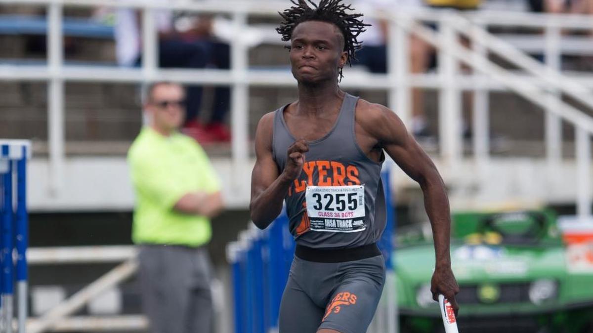 East St. Louis’ Deonte Anderson competes in the Class 2A 400-meter relay preliminary in Charleston last year.