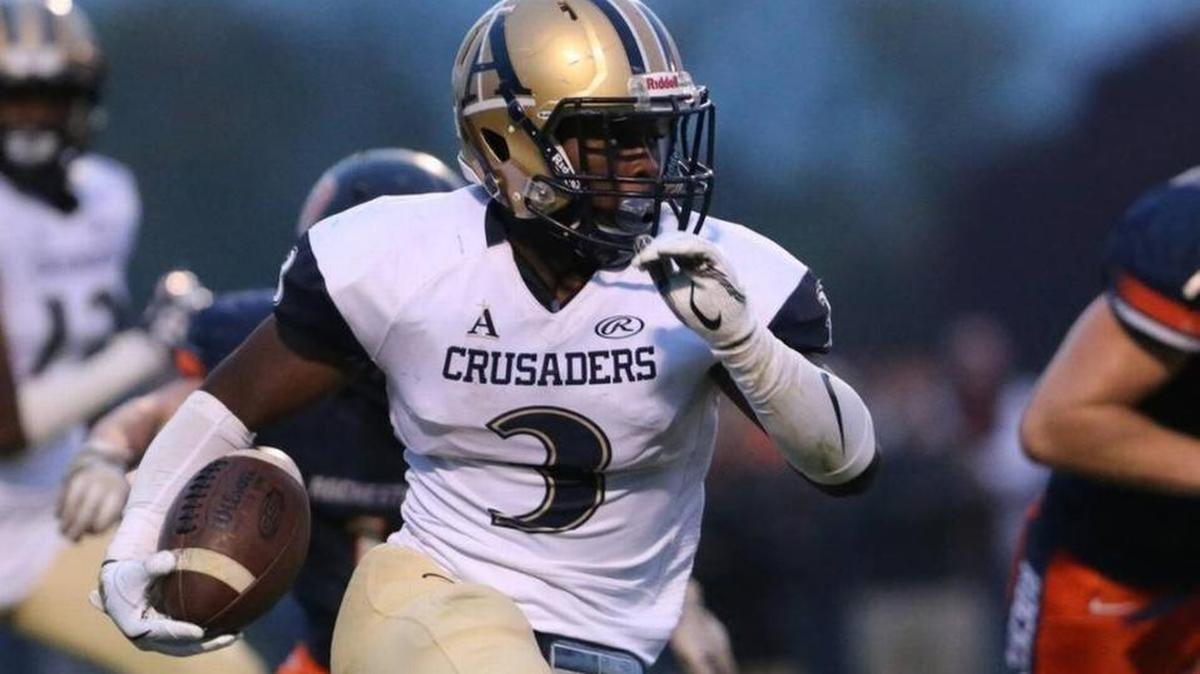 Althoff running back Richard Cosey gains yardage during a second-round playoff game against Rochester.