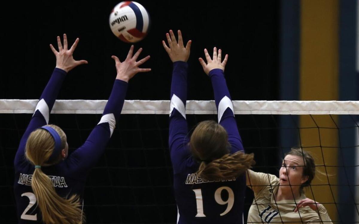 In this BND file photo, Mascoutah’s Tieghan Morio (19) and Lacey Albers await a spike from Althoff’s Briana Nowak (10) during a match on Sept. 11, 2014.