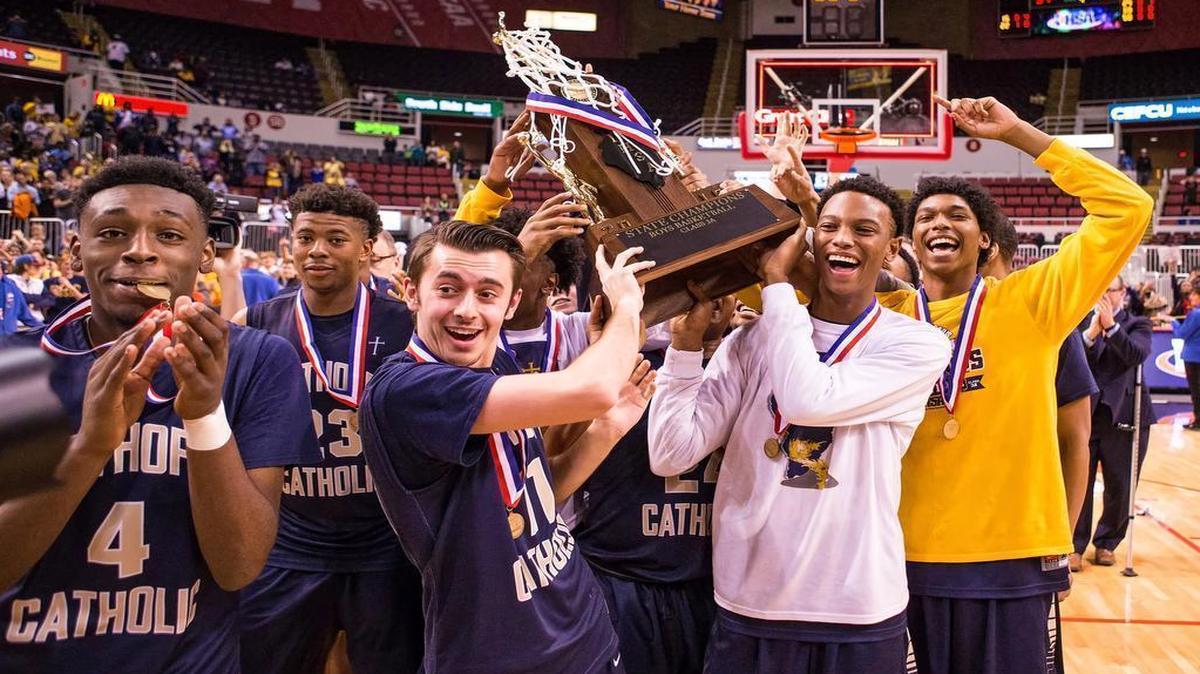 Althoff’s players celebrate winning the Class 3A state championship Saturday’s at Peoria’s Carver Arena. The Crusaders defeated New Lenox’s Lincoln-Way West 63-37 to become the first team in Belleville history to win a state title. See a gallery of photographs and a videos at bnd.com.