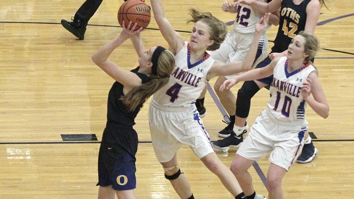 O’Fallon’s Ashley Schloer drives to the basket as Okawville’s Madelyn Tepe tries to block her shot.