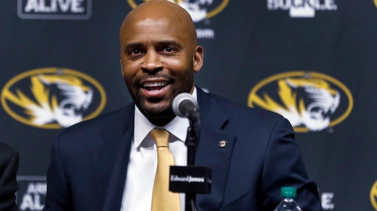 Cuonzo Martin, who grea up in East St. Louis and was a two-time state champ at East St. Louis Lincoln High School, smiles during his introduction as Missouri men's basketball coach Monday, in Columbia, Mo. Martin spent the past three seasons as coach at California and comes to Missouri with hopes he can revive the struggling program. (AP Photo/Jeff Roberson)