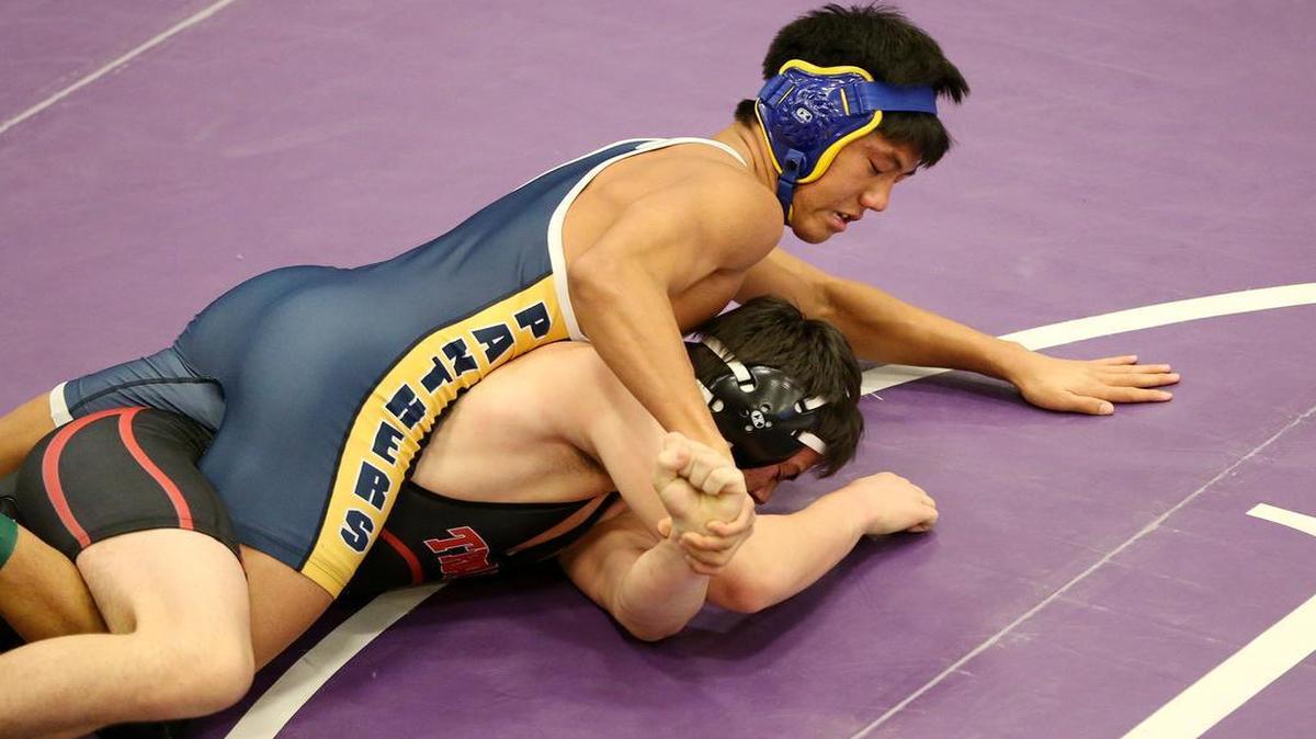 O'Fallon's Nick Kelly wrestles Triad's Mark Tucker during the Mascoutah wrestling tournament. Kelly placed 3rd and Tucker placed 6th in the 160 pound division.