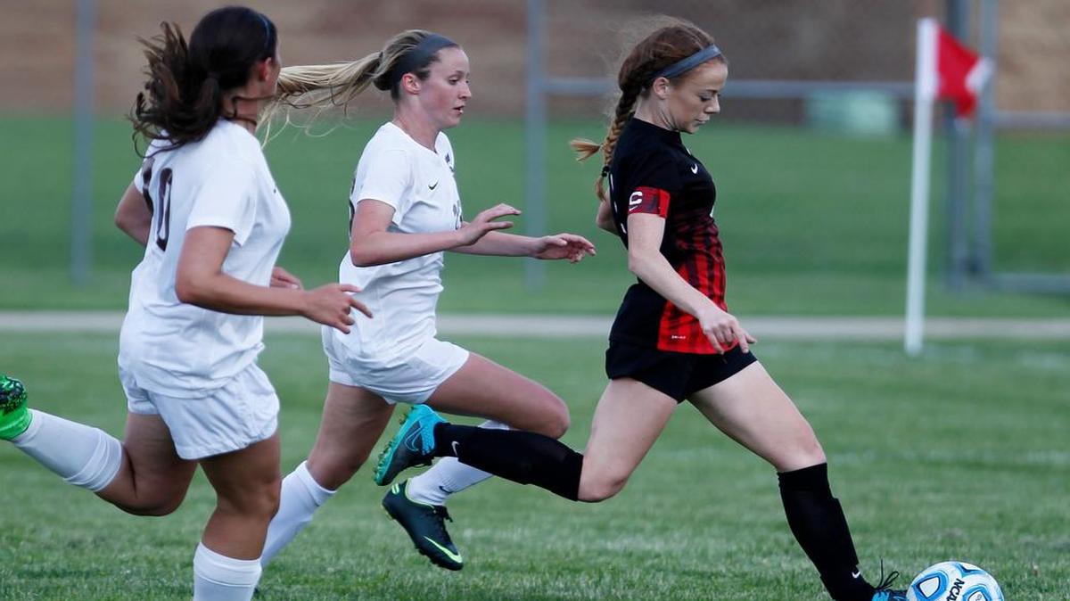 Granite City's Lexi Grote outruns Belleville West's Abby Haas and Jamie Adams to score in the first half of their regional game at Granite City on Wednesday.