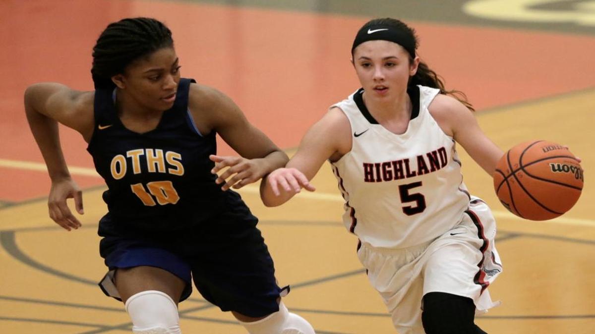 O’Fallon’s Jayla Stubblefield guards Highland’s Elie Brown as she drives the ball down court during their game at the 31st annual Scott Credit Union Highland Tournament.