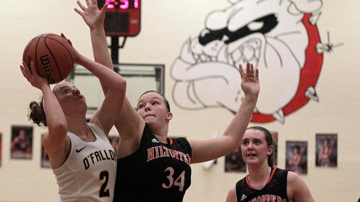 Paige Mueller puts up a shot over Hillsboro’s Aubry Rupert in O’Fallon’s win on Saturday over the Hilltoppers in the Highland Tournament.