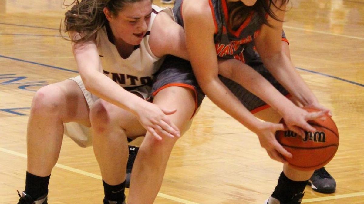 Waterloo's Sydney Luedeman battles Benton's Taylor Mosely for a loose ball during the Class 3A Regional Title Game at Columbia on Friday night.