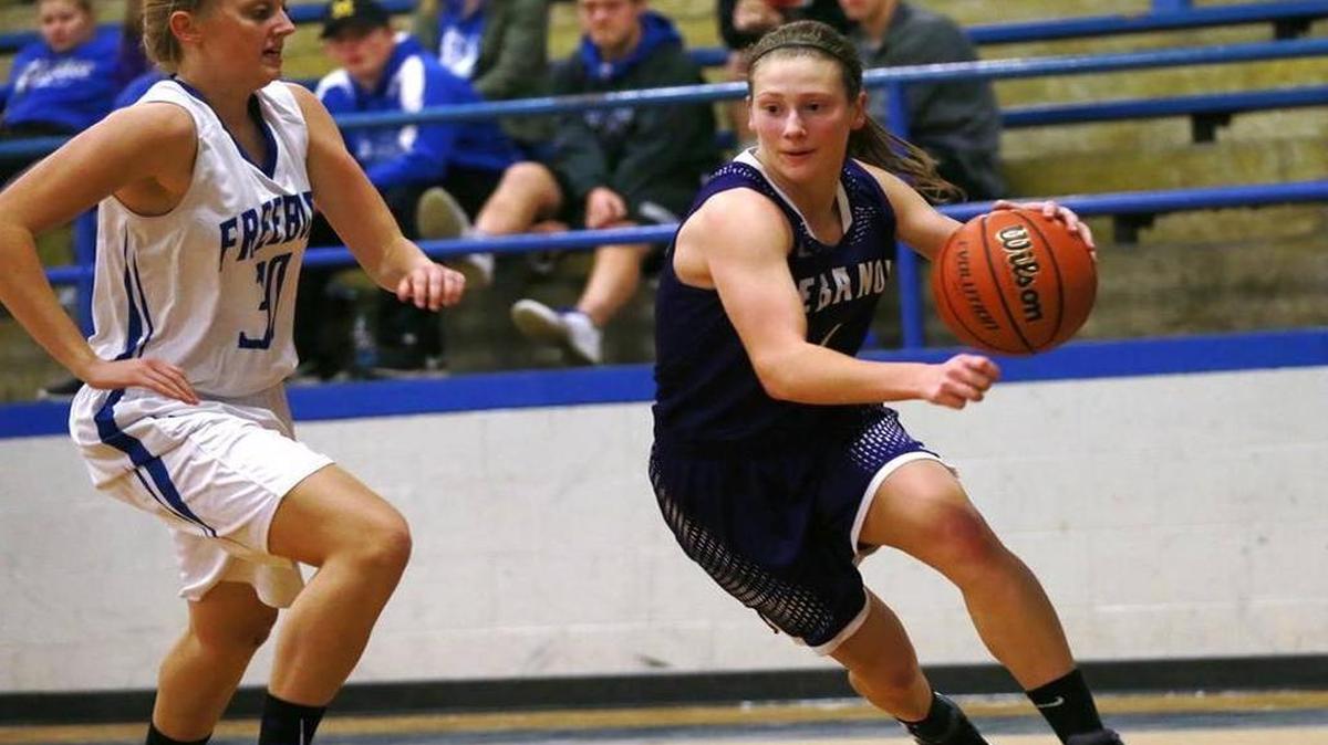 Lebanon’s Emily Reinneck pulls away from Freeburg's Abby Mirly during their game at Freeburg on Monday. New Athens, with six wins, will challenge the Greyhounds for first place in the Cahokia Conference Friday.