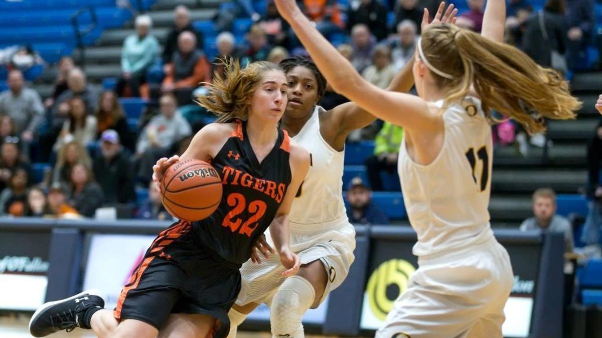 Edwardsville’s Kate Martin drives against O’Fallon’s Ashley Schloer during Friday’s game at O’Fallon High School.