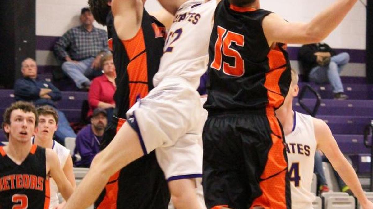 Valmeyer's Vaughn Larson drives the lane against Marissa's Kyle Smith during the Class 1A Regional at Lebanon Monday night.