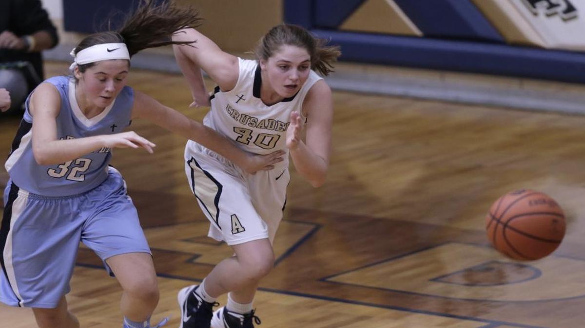 Althoff’s Emily Myatt and Mater Dei’s Margo Lampe scramble after a loose ball during their game at Althoff earlier this season. The two teams will play for a regional title in their third matchup of the season.