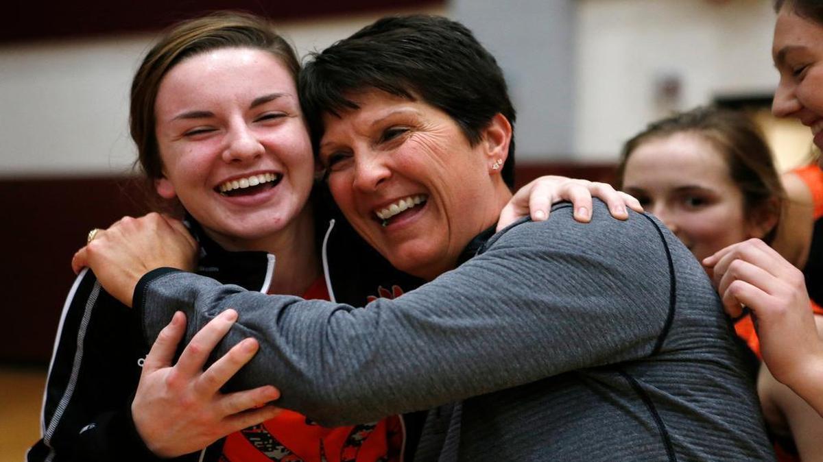 Edwardsville head coach Lori Blade is congratulated by sophomore Lorie Cashdollar after their win over Belleville West on Thursday.