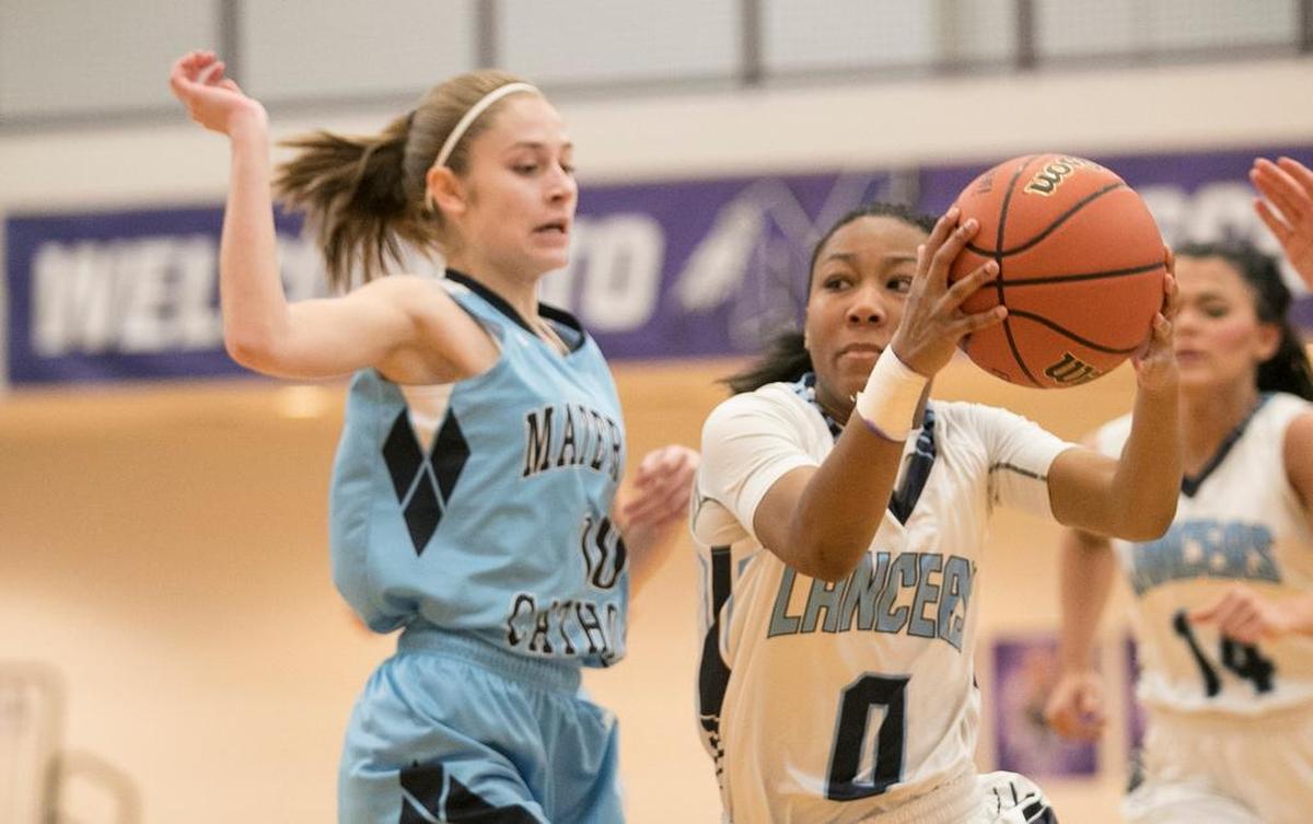 Kaylah Rainey as she drives to the basket against Mater Dei.