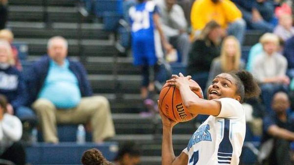 Belleville East’s Jailyn McClenny goes hard to the basket in a game against O’Fallon Nov. 30.