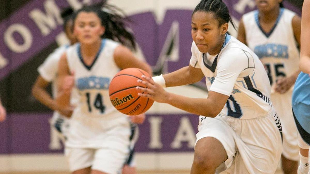 Belleville East’s Kaylah Rainey heads down court during the annual Mascoutah girls invitational tournament.