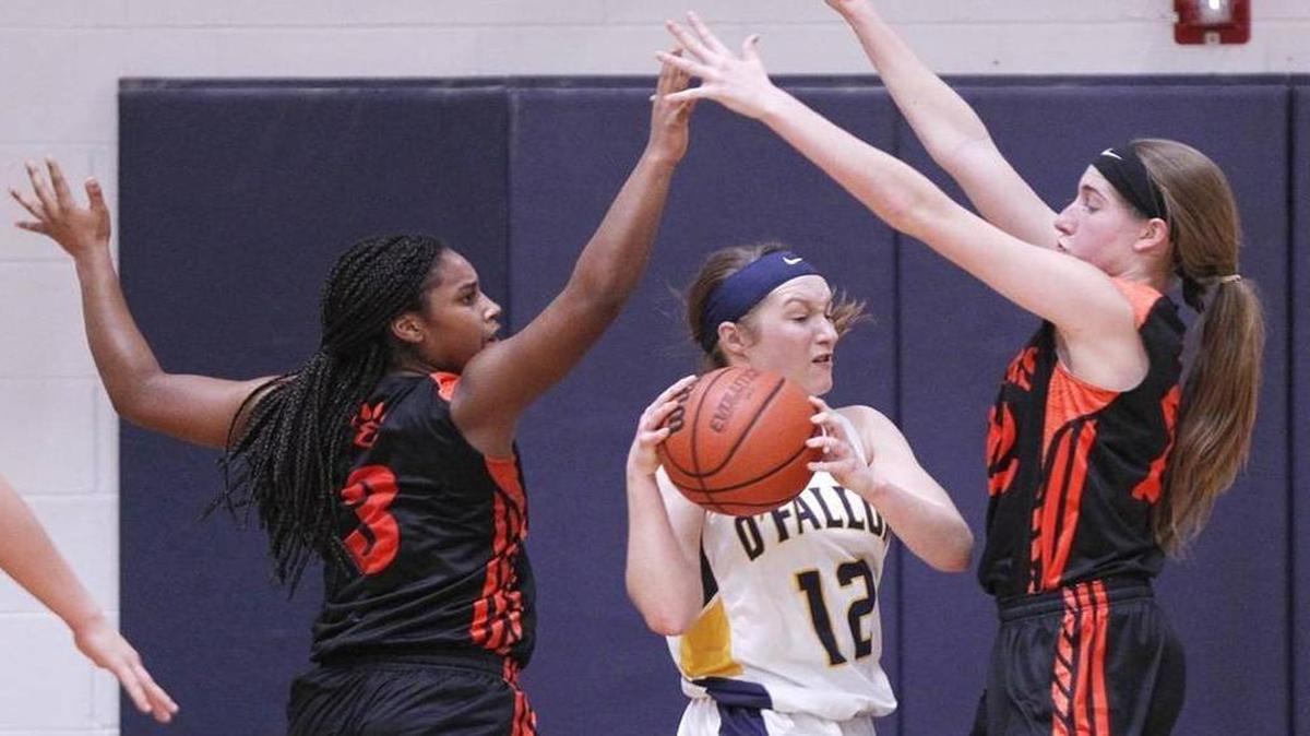 Marta Durk, No. 12, is among area scoring leaders at more than 17 points per game.