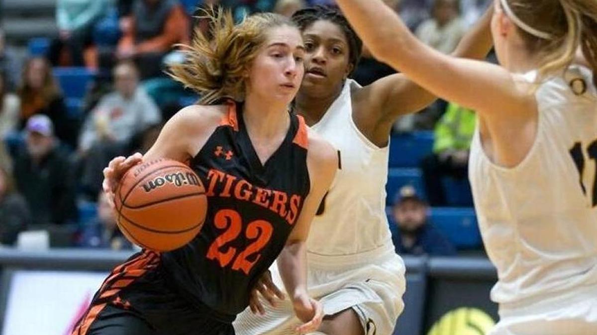 Edwardsville’s Kate Martin drives against O’Fallon’s Ashley Schloer in a Jan. 5 game at O’Fallon Township High School.