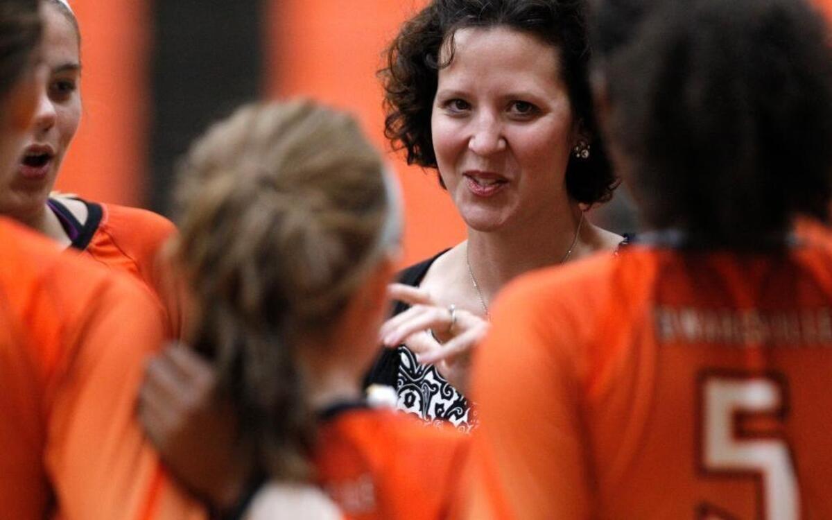 Edwardsville head volleyball coach Jami Parker talks with her team earlier this season.