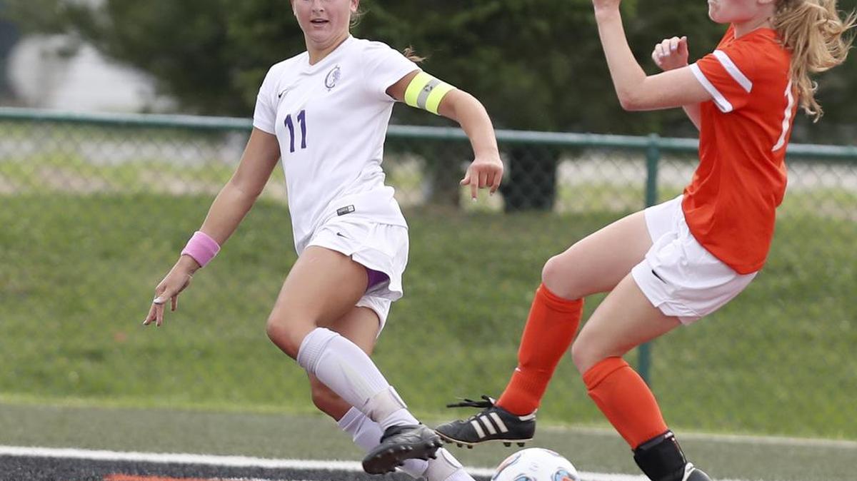Collinsville’s Emily Holten crosses the ball to assist on the first goal against Normal during their championship game of the Class 3A Edwardsville Sectional.