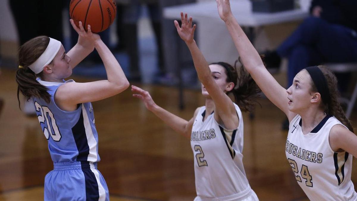 Mater Dei’s Kierra Winkeler shoots over Althoff Amanda Kaltwasser and Karinna Gall during their Class 2A Althoff High Regional Championship game last spring..