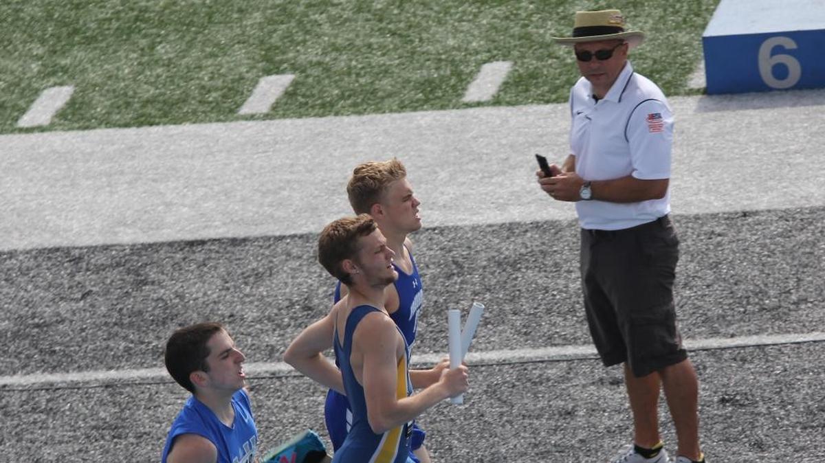 Swansea resident Jason Gray keeps tabs on a relay race. He was honored by the IHSA as one of its Officials of the Year.