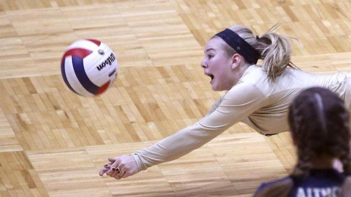 Althoff’s Katie Allard, shown here diving for a ball, has been one of the Crusaders’ top defensive players this season.