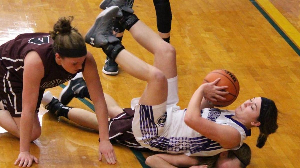 Central's Breanne Jansen battles for a loose ball against Sesser-Valier in the Trico Sectional Monday night.