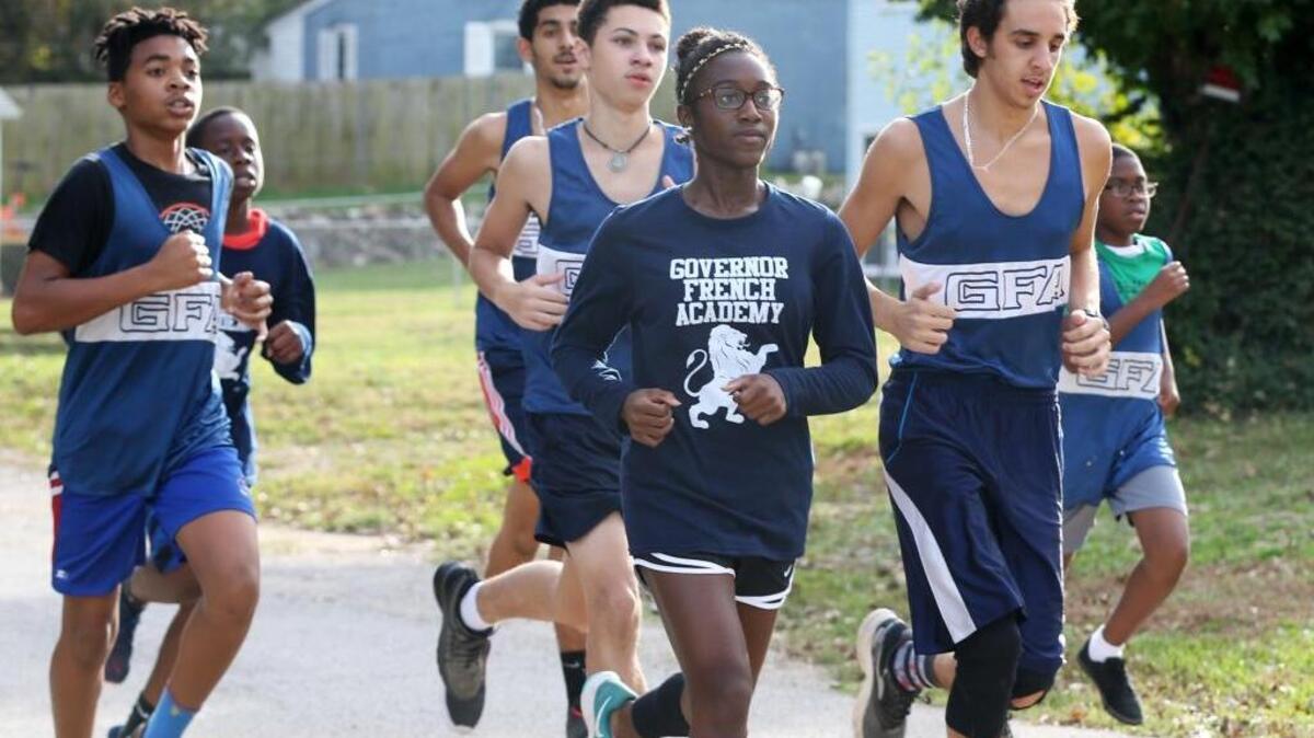 Sarozjani Hunter of Governor French Academy works out with her biggest supporters, members of the boys cross country team. Sarozjani Hunter will be the first athlete from Governor French Academy to compete at the state championship level.