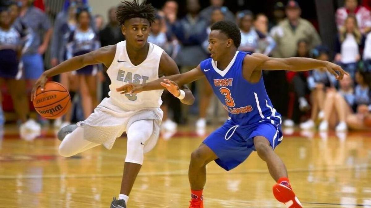 Former Belleville East guard Rico Sylvester brings the ball up court against graduated East St. Louis defender Marrion Chairs during last year’s SWC at the E event at SIUE’s Vadalabene Center.