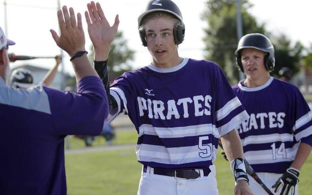 Andrew Whipple and Cole Juelfs are congratulated on the Valmeyer bench after scoring in a Pirates’ sectional win last week. Both pitched in the team’s super-sectional victory over Abingdon-Avon Tuesday, which sends Valmeyer to its first state final four.