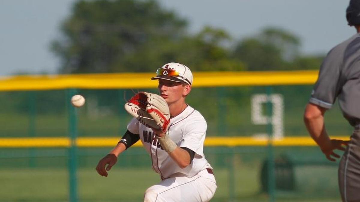 Belleville East’s Jordan Yates is forced out at second by Belleville West’s Buddy Gore during their regional game on Thursday. See a gallery of photographs and a video at bnd.com.