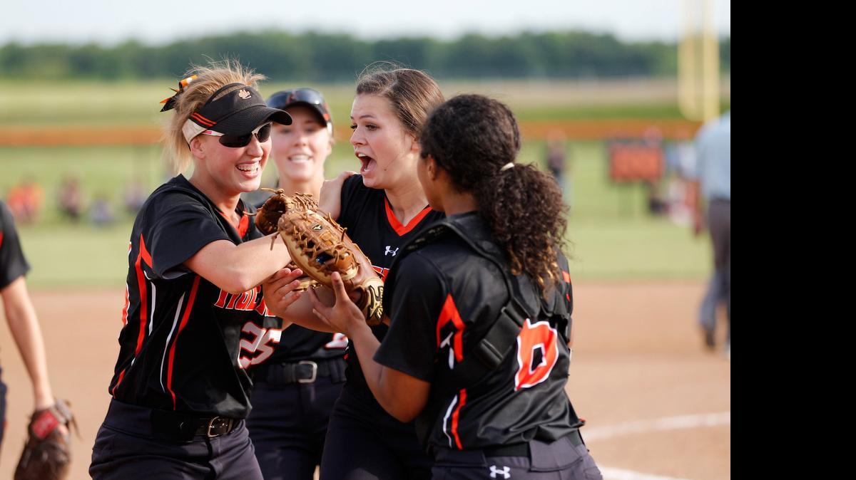 
Edwardsville picture Jen Kocevar is congratulated by her teammates after leading the Tigers to a 4-2 win over previously unbeaten Waterloo on Friday in Waterloo.

