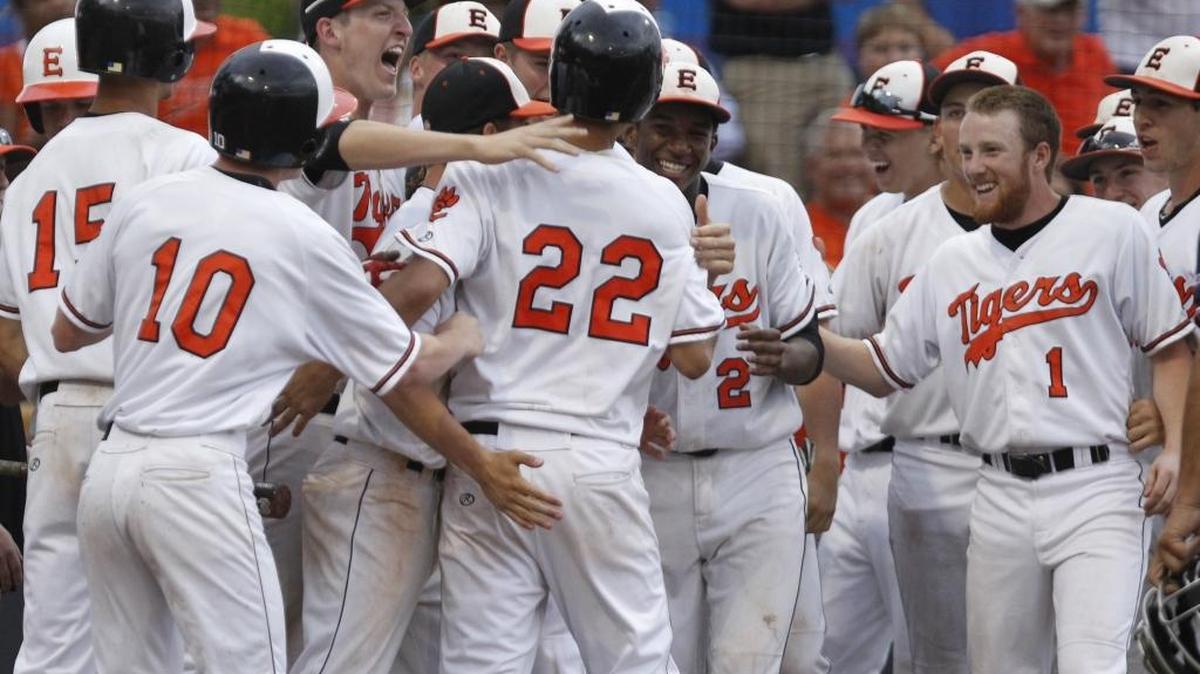 Celebrations like these have become commonplace for Edwardsville during a 37-year run of 20 or more victories. Here, Edwardsville's (22) Aaron Jackson is congratulated by his teammates after his three-run homer during a 2015 sectional game against Belleville West.
