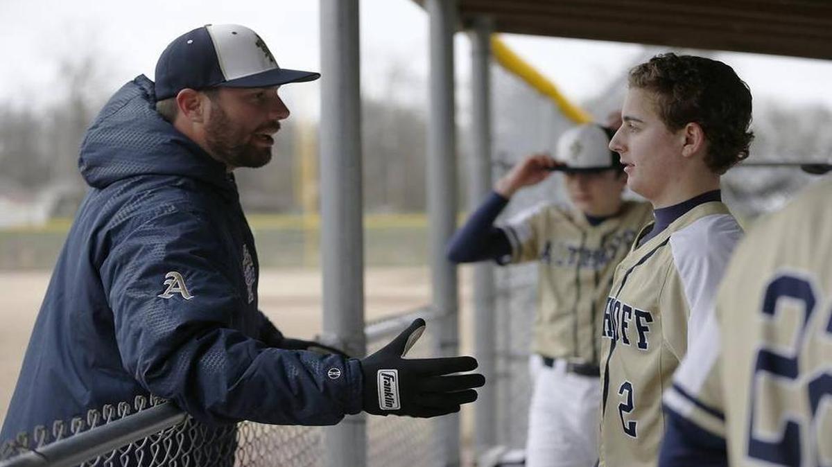Former major league pitcher Randy Wells, left, returns for his second season as the varsity baseball coach at Althoff High School.